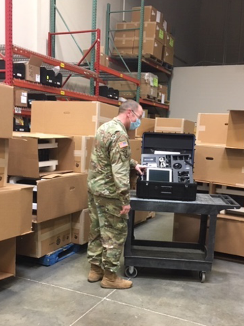 CPT Adam Hever inspects Savi Portable Deployment Kits III at FSE's Maryland location, part of a joint public-private partnership to deliver cutting-edge logistics tools to the Army National Guard